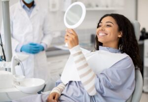 Periodontist consulting with a patient, discussing receding gums treatments.